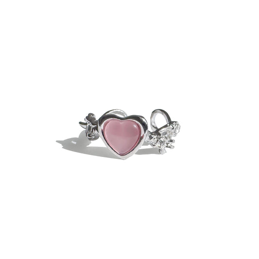Statement pink heart ring in Y2K style displayed with light shadows