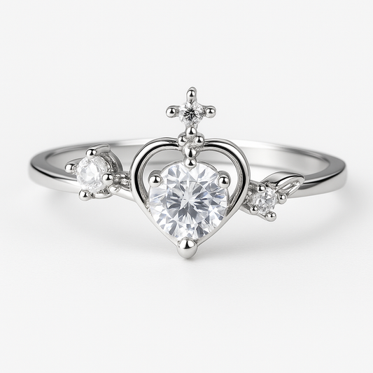 Close-up of silver heart crystal ring with star and flower detailing