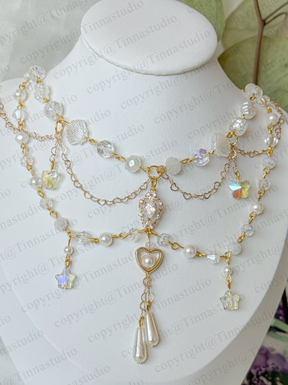 Celestial bloom white pearl layered necklace with heart charm and floral accents – handmade bridal jewelry