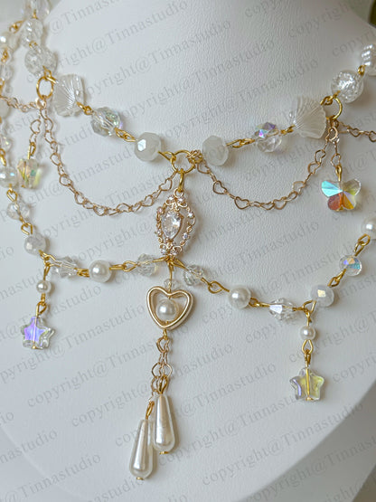 Celestial bloom white pearl layered necklace with heart charm and floral accents – handmade bridal jewelry