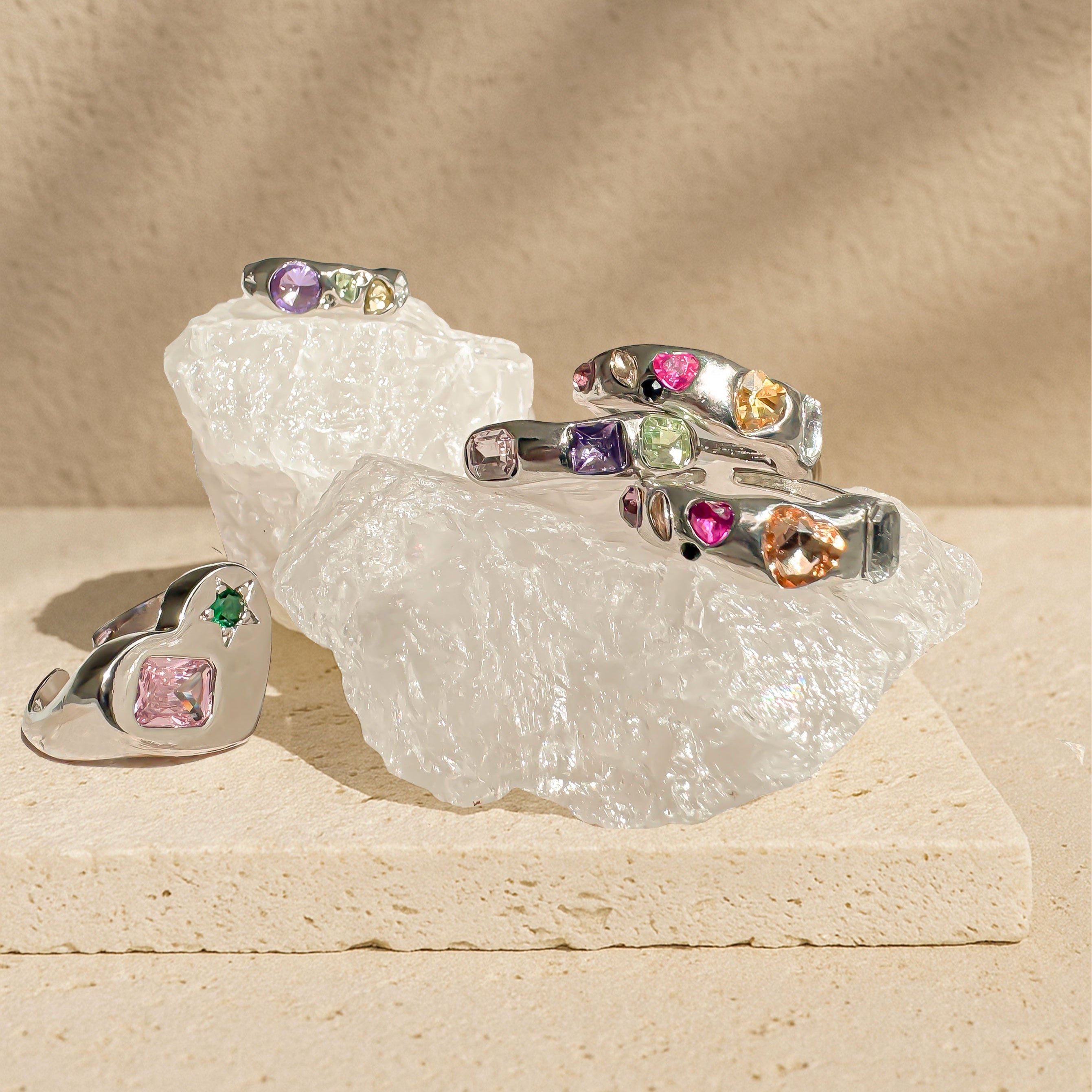 Chrome silver Y2K rings with colorful simulated gems in open adjustable design, candy-colored statement ring styled for tiktok, streetwear and gen Z fashion