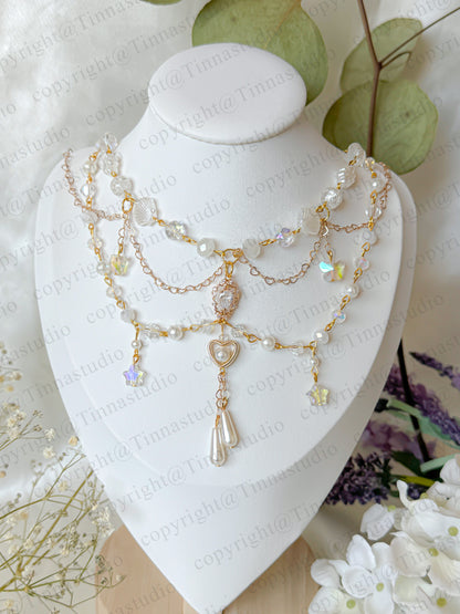 Celestial bloom white pearl layered necklace with heart charm and floral accents – handmade bridal jewelry