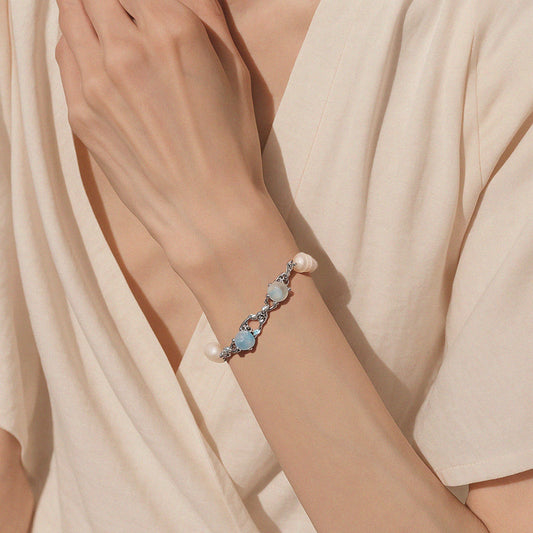 Silver chain bracelet with irregular links, opalite stones and freshwater pearls