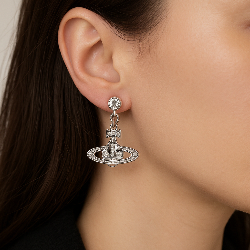 Cosmic orbit silver rhinestone earrings with bow and planet design – inspired by Y2K & space aesthetic