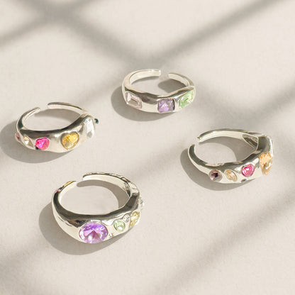 Chrome silver Y2K rings with colorful simulated gems in open adjustable design, candy-colored statement ring styled for tiktok, streetwear and gen Z fashion