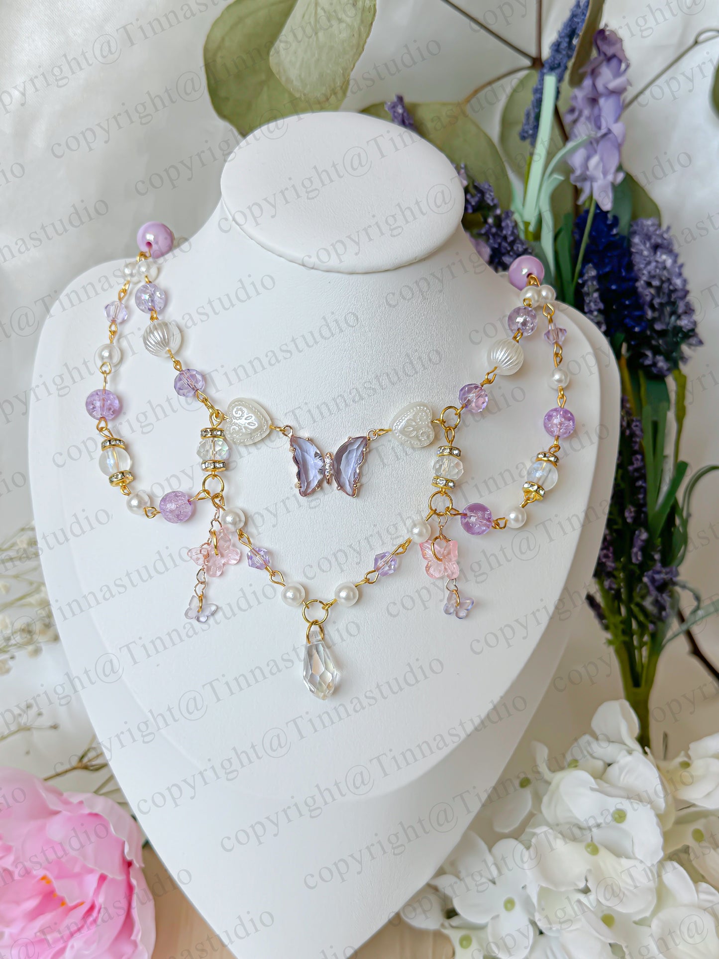 Layered handmade fairycore necklace in soft pastel purple tones