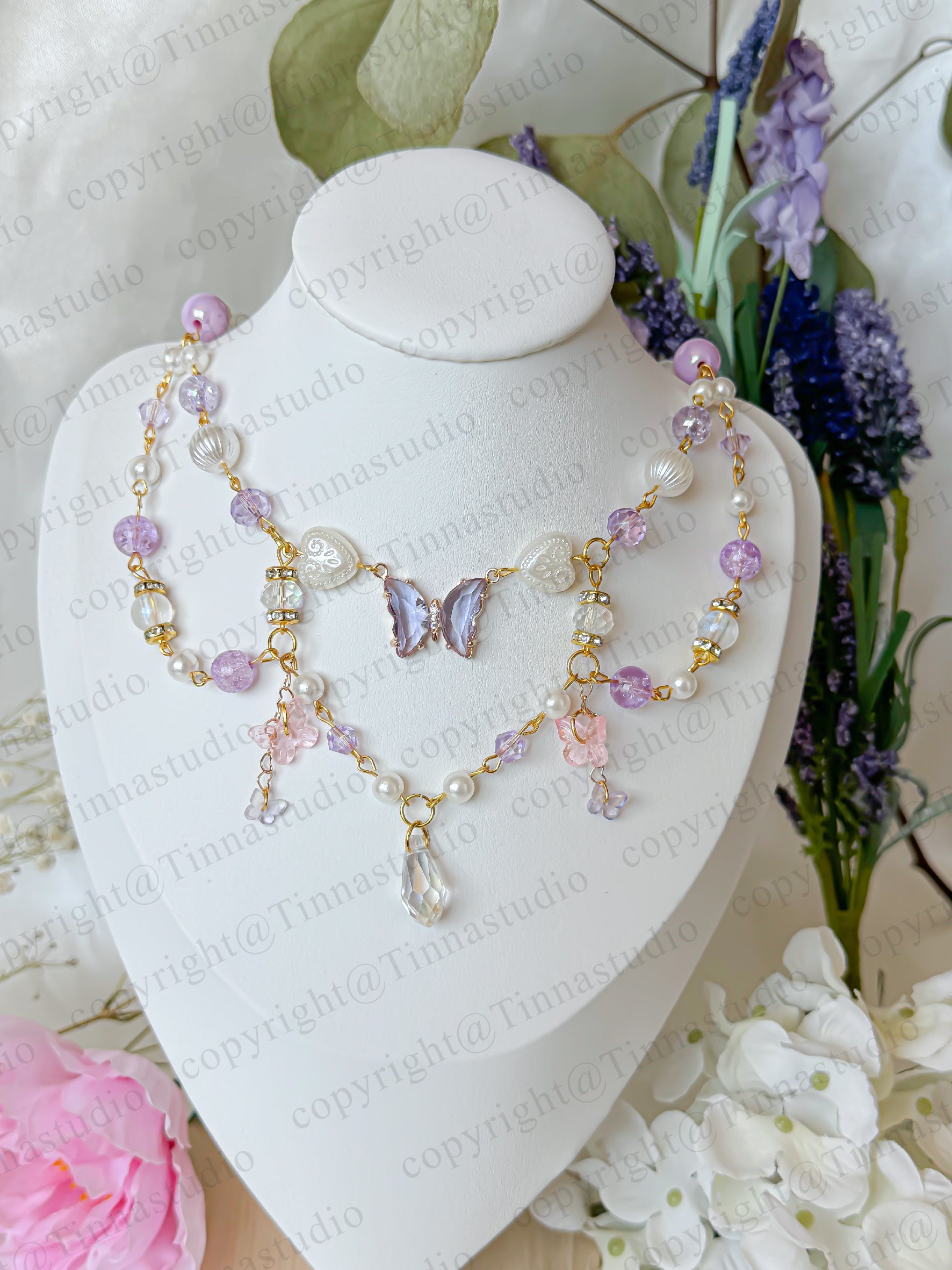 Layered handmade fairycore necklace in soft pastel purple tones
