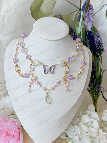 Layered handmade fairycore necklace in soft pastel purple tones