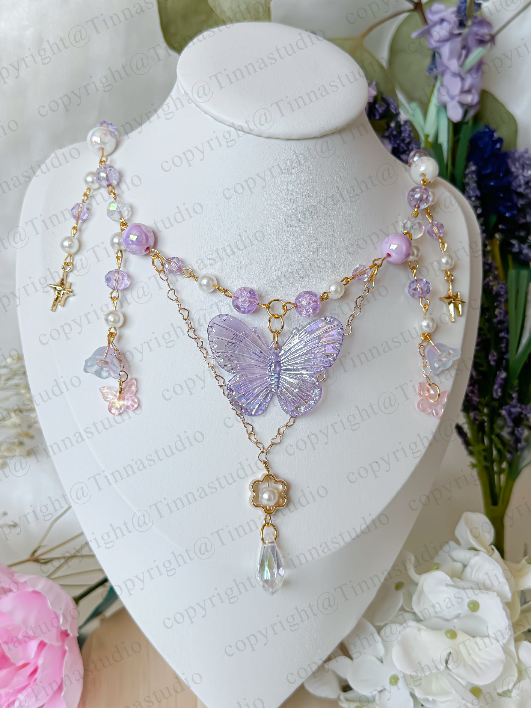  Detail of custom butterfly necklace clasp and adjustable chain in gold finish.
